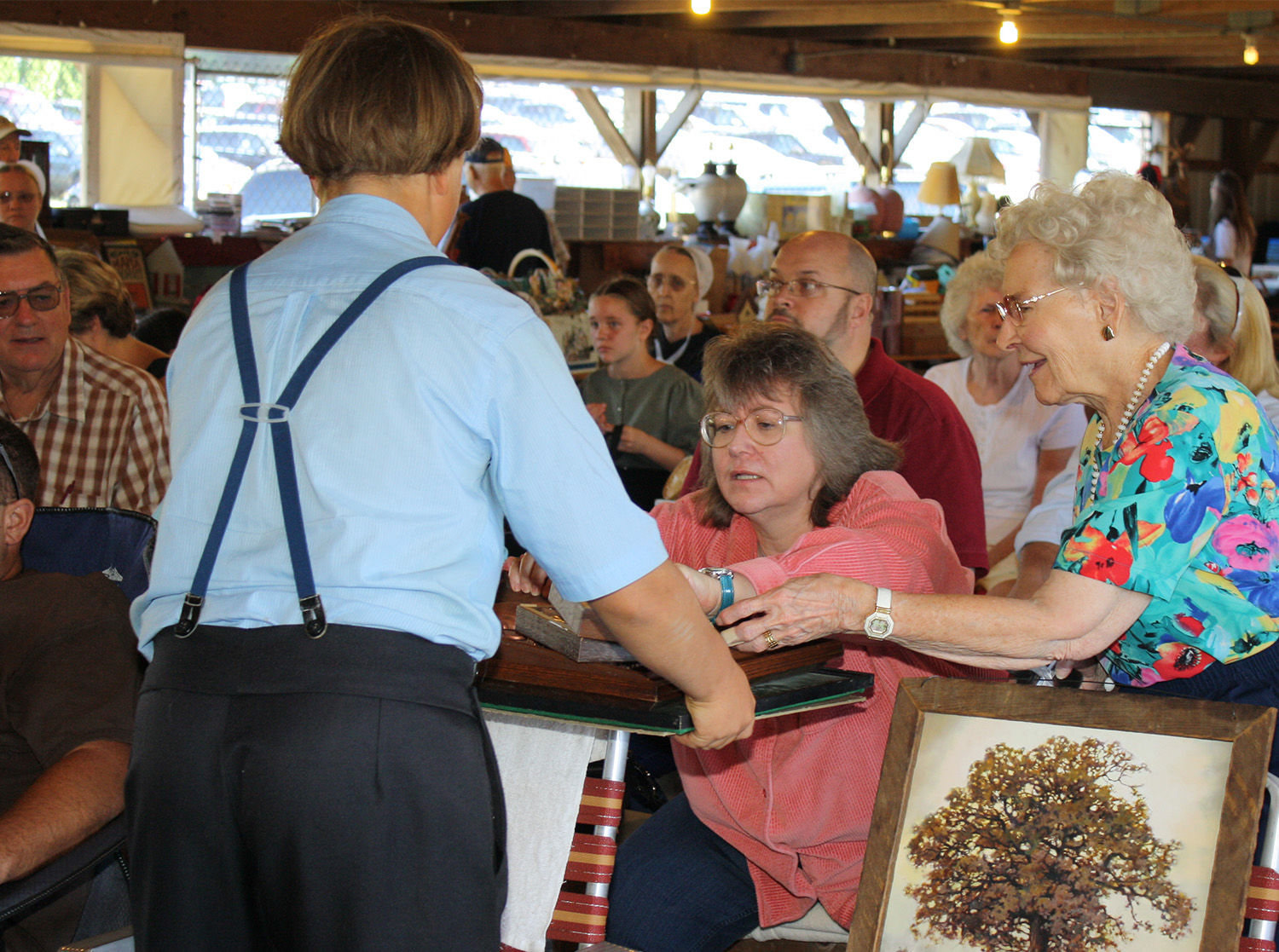 helper at hospice auction S1 Living.jpg